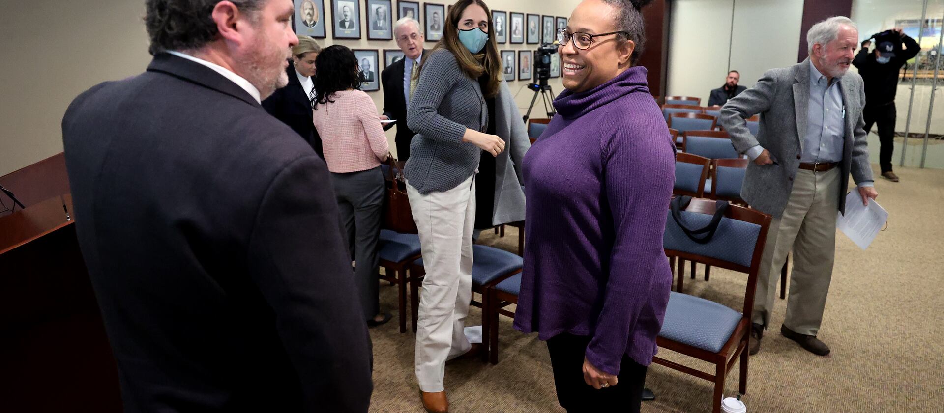 Davis County Attorney Troy Rawlings, left, talks with Teneille Brown, center, and Adrienne Gillespie Andrews.