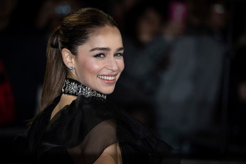 Actress Emilia Clarke poses for photographers upon arrival at the premiere of the film “Last Christmas” in London.