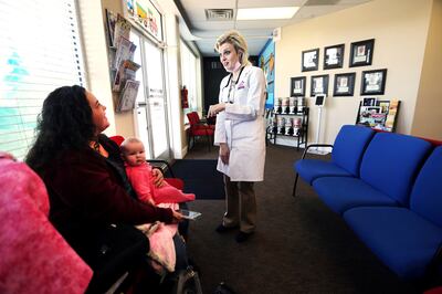 Dr. Jennifer Brown updates Karen Clark about daughter Mersadie's condition after performing dental work on her at Hillfield Pediatric & Family Dentistry in Layton on Tuesday, Nov. 28, 2017.