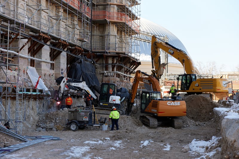 Crews work near the historic foundation of the Salt Lake Temple during the renovation in 2022.
