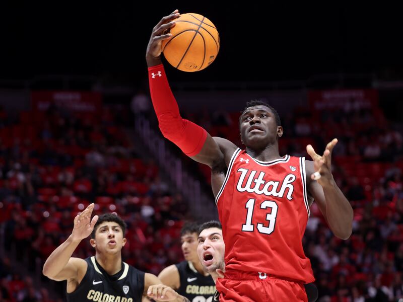 Utah Utes center Keba Keita (13) grabs a rebound as Utah and Colorado play in the Huntsman Center in Salt Lake City.