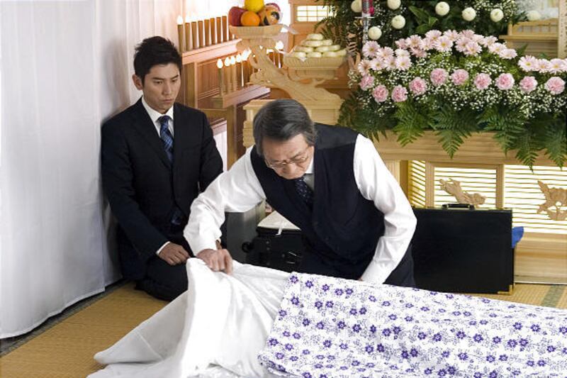 Masahiro Motoki, left, stars as Daigo Kobayashi and Tsutomu Yamazaki is Sasaki in the Japanese film "Departures."