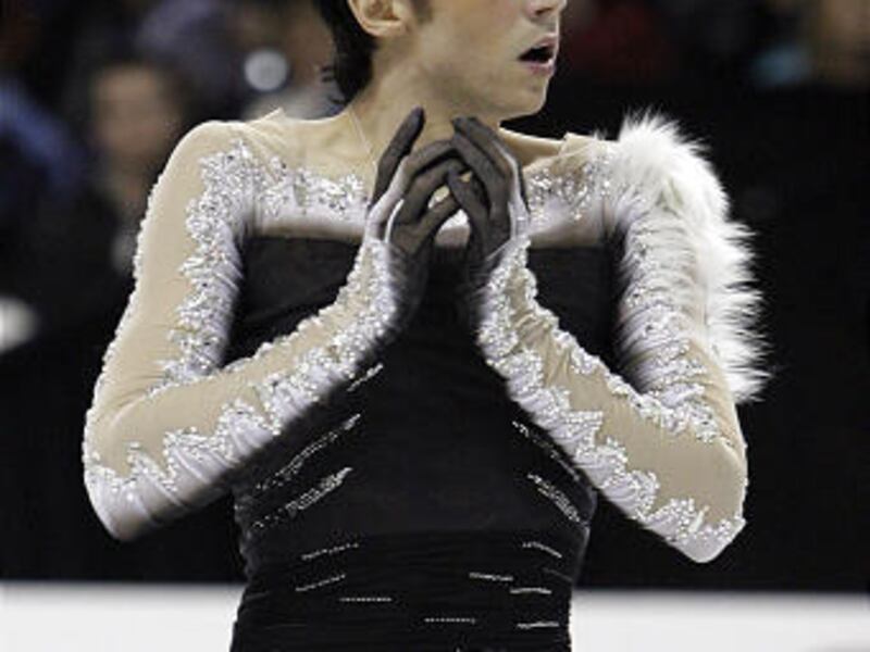 In this Jan. 17, 2010 file photo, Johnny Weir competes during the men's free skate at the U.S. Figure Skating Championships in Spokane, Wash. Weir is staying at the Olympic village because he is concerned about his safety after receiving what he considers