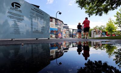 Visitors look at memorials left at the Pulse nightclub in Orlando, Florida, on Sunday, June 9, 2019.