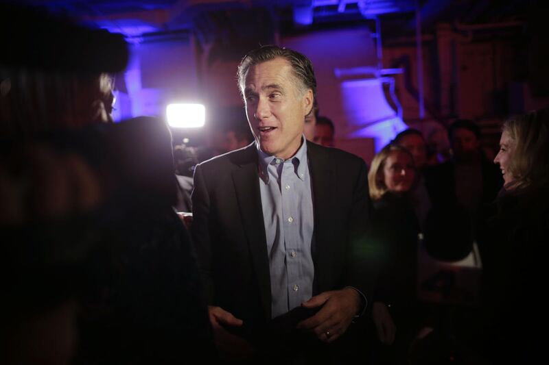 Mitt Romney, the former Republican presidential nominee, talks with people after speaking during the Republican National Committee's winter meeting aboard the USS Midway Museum Friday, Jan. 16, 2015, in San Diego.