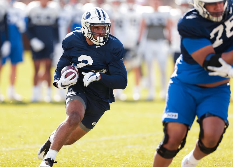 BYU running Chris Brooks carries the ball during spring camp in Provo on Monday, March 21, 2022.