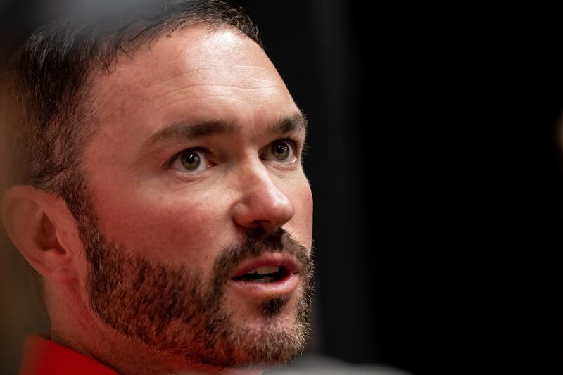 Utah lacrosse coach Andrew McMinn talks to reporters