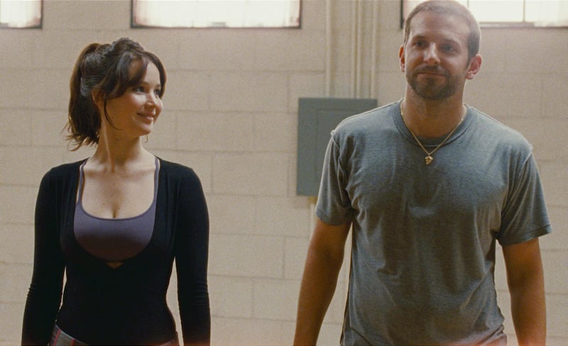 Jennifer Lawrence and Bradley Cooper play a pair of mentally unstable singles in “Silver Linings Playbook.”