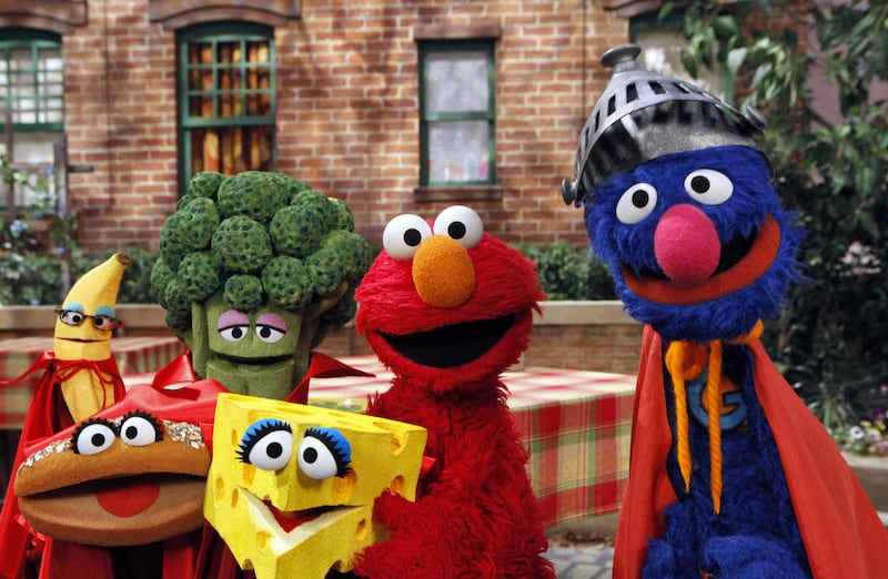 This June 22, 2010 file photo released by Sesame Workshop, features “Sesame Street” characters Elmo, second from right, and Super Grover, right. The cast of “Sesame Street” will be making a socially distanced special for kids to help tackle the coronavirus.