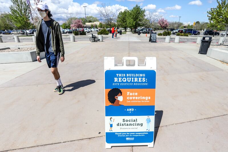 A man walks into the Mountain America Expo Center in Sandy for a COVID-19 vaccine.