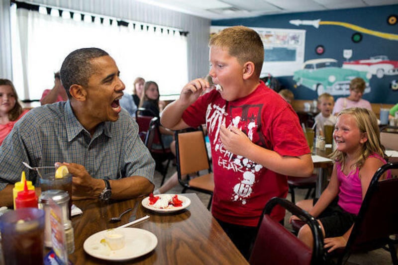 The White House wished Twitter followers and Facebook Fans a "Happy Pie Day" with a photo of a child with a mouthful of pie beside President Barack Obama.