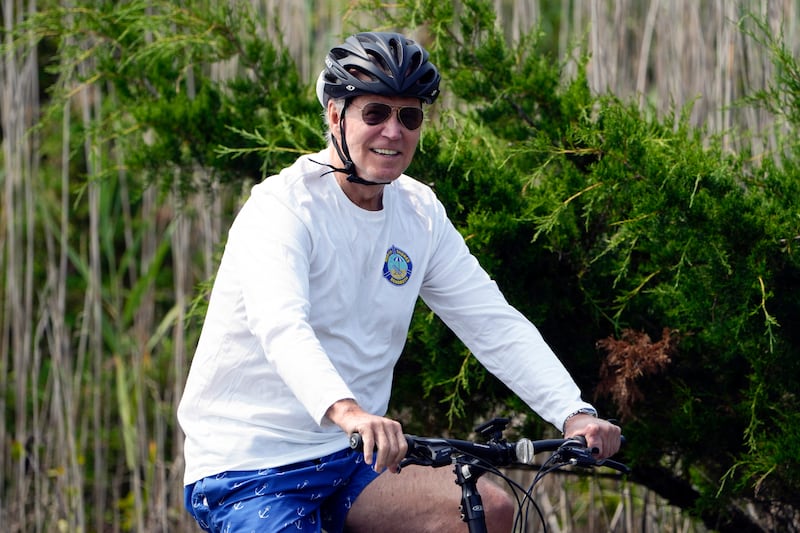 President Joe Biden rides his bike at Gordons Pond in Rehoboth Beach, Del., on Tuesday, Aug. 1, 2023.