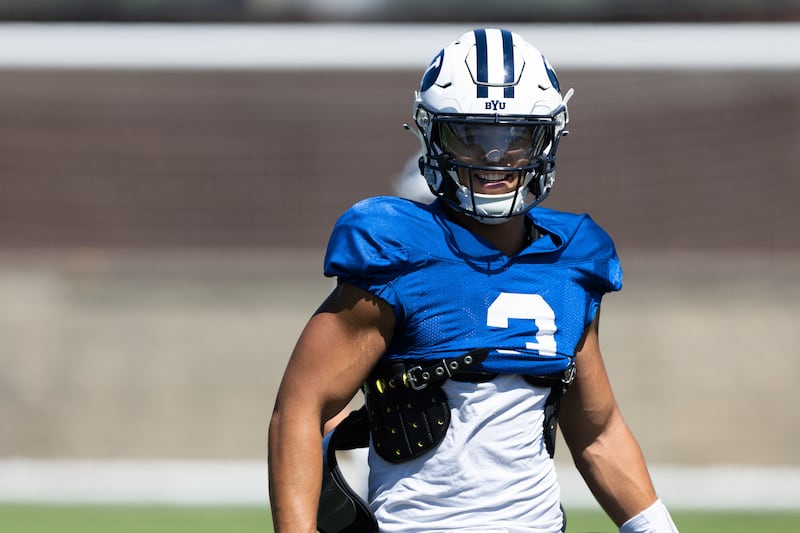 BYU quarterback Jaren Hall smiles during practice Monday, Aug. 22, 2022, at the outdoor practice facility in Provo.