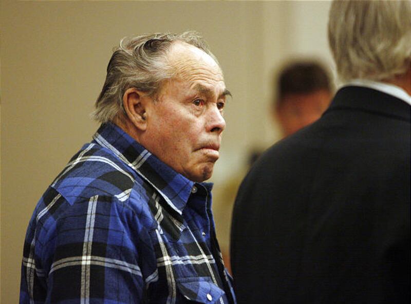 John Clinton Smith with defense attorney Ed Brass in 3rd District Court earlier this month.