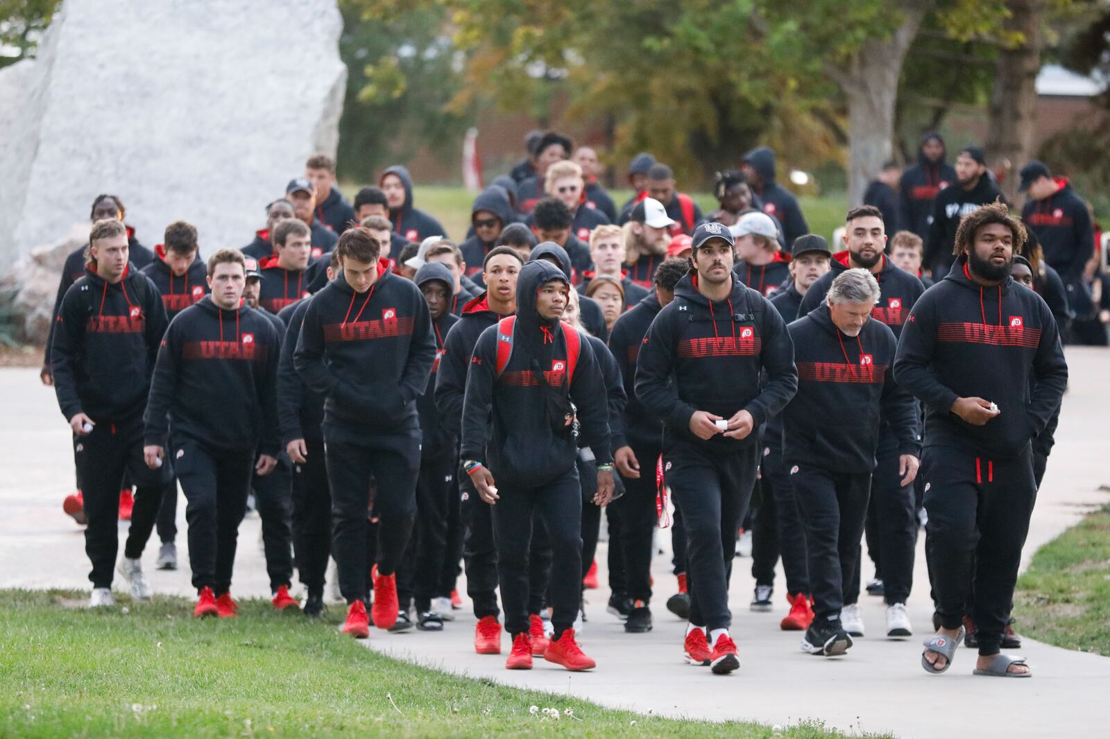 University of Utah football players arrive to a candlelight vigil remembering the life of slain student-athlete Aaron Lowe.