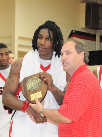 Jae Crowder receives the 2009 player of the year award from the Georgia Collegiate Athletic Association Commissioner David Elder while attending South Georgia Technical College.