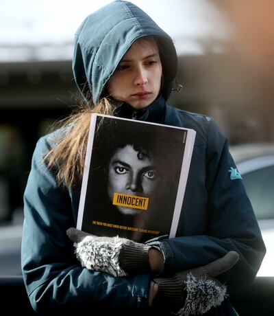Morgan Steffen protests "Leaving Neverland," a documentary about Michael Jackson, outside of the Egyptian Theatre during the Sundance Film Festival in Park City on Friday, Jan. 25, 2019.