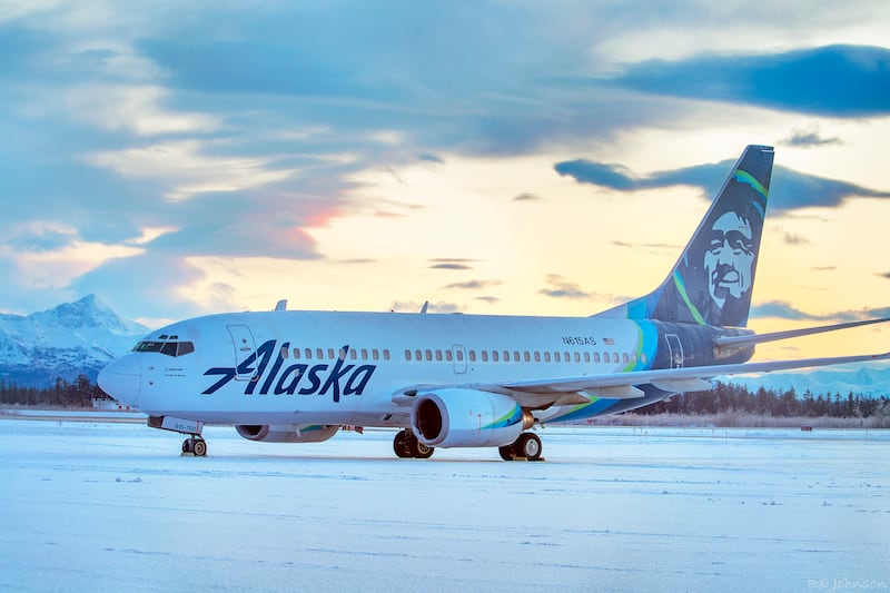 This early Sunday, Nov. 15, 2020, photo provided by R E Johnson shows an Alaska Airlines jet at Yakutat Airport in Yakutat, Alaska.