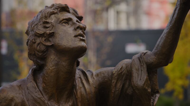 Joseph Smith is seen gesturing toward Heavenly Father and Jesus Christ in the new First Vision statue on Temple Square.