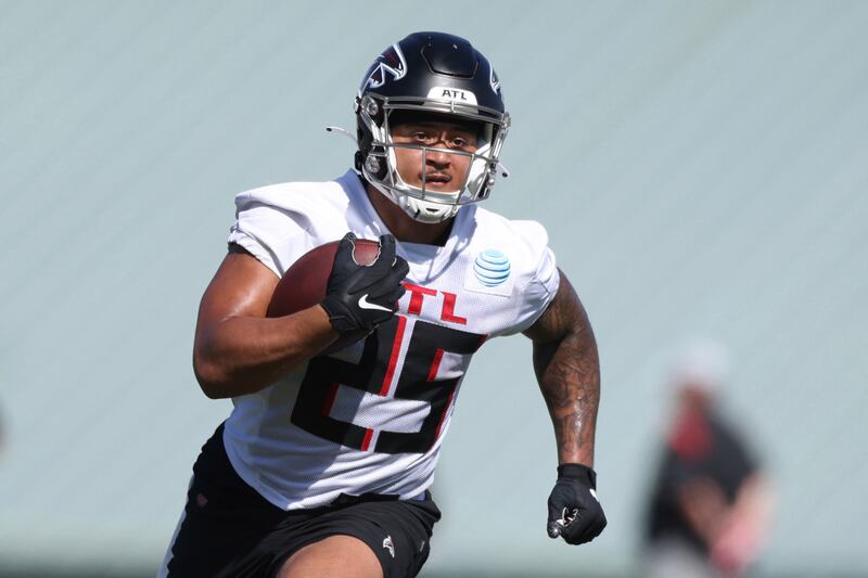 Atlanta Falcons running back Tyler Allgeier (25) runs a drill during NFL football training camp in Flowery Branch, Ga., Thursday, July 28, 2022.