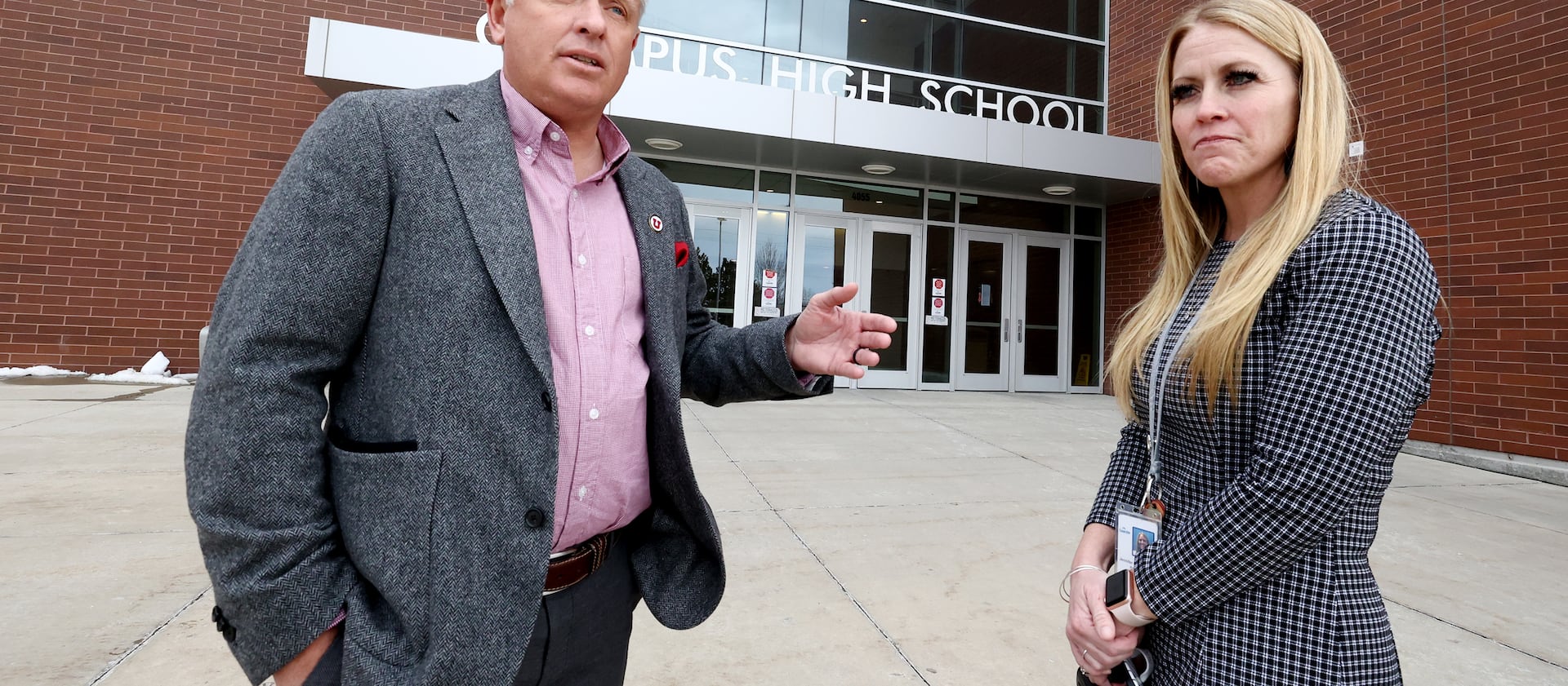 University of Utah President Taylor Randall and Olympus High School Principal Jen Christensen talk at the Holladay school.
