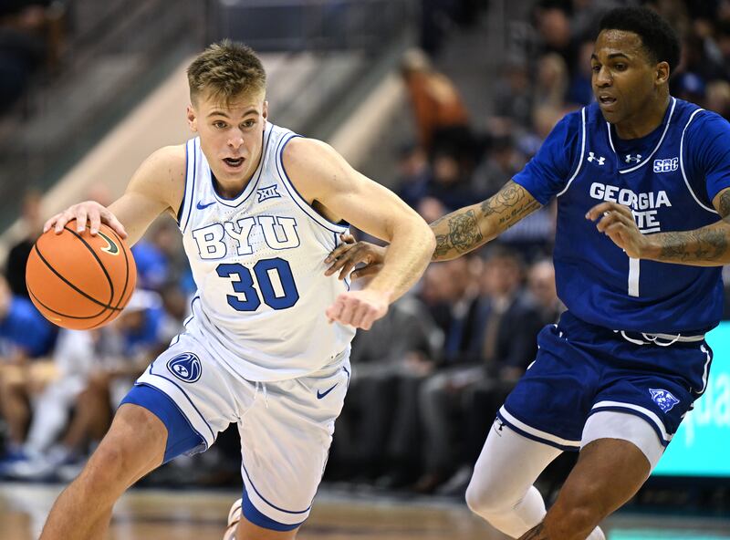 BYU Cougars guard Dallin Hall (30) drives on Georgia State Panthers guard Dwon Odom (1) at the Marriott Center on Dec. 16, 2023.