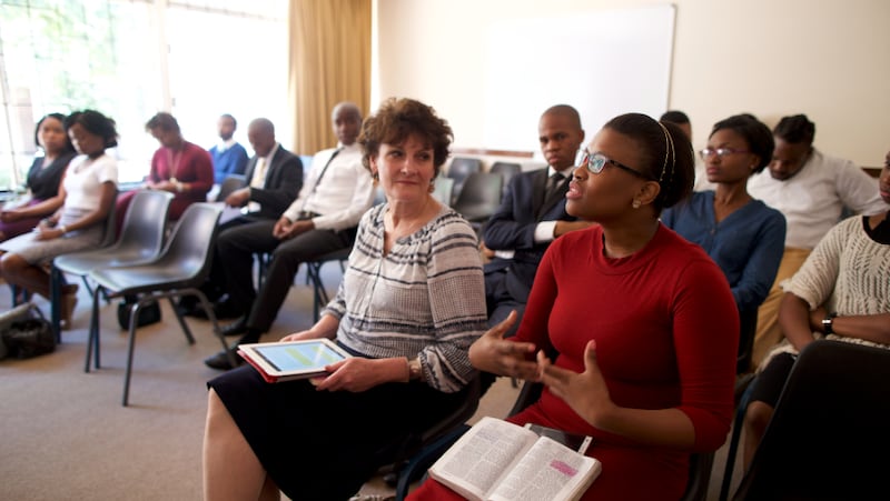 A woman participates in a Sunday School class.