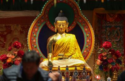 People on the Interfaith Bus Tour visit the prayer room at the Tibetan Community Center in Salt Lake City on Tuesday, Feb. 19, 2019. As part of Interfaith Month, people are able to take a bus to various churches in the valley. The tour included the Tibeta