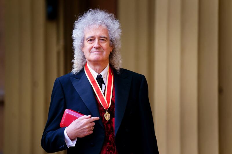 Sir Brian May poses after being made a Knight Bachelor by King Charles III during an investiture ceremony at Buckingham Palace, London.