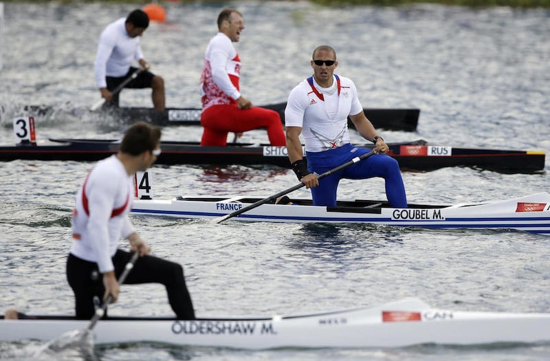 France's Mathieu Goubel, right, looks at Canada's Mark Oldershaw, left foreground, after Goubel won a men's canoe single 1000m semifinal in Eton Dorney, near Windsor, England, at the 2012 Summer Olympics, Monday, Aug. 6, 2012. Oldershaw finished second.