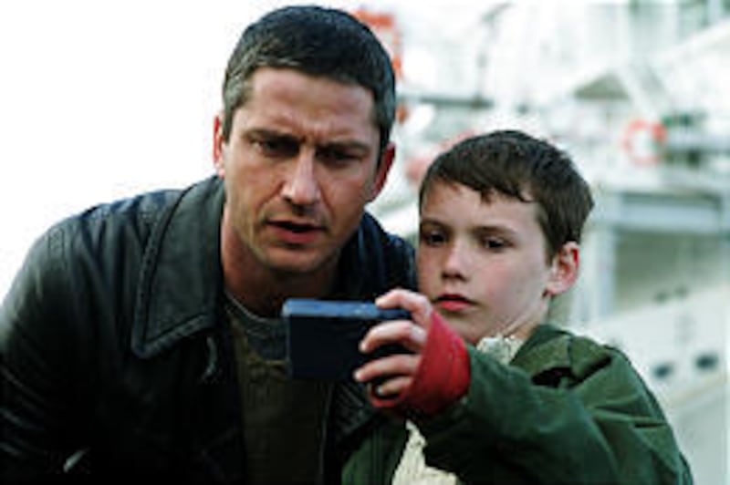 Gerard Butler, left, plays a stranger pretending to be the father of Frankie (Jack McElhone) in "Dear Frankie."
