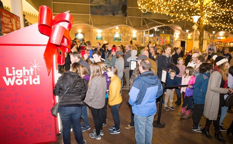 The public chooses items to donate at the LightTheWorld Giving Machines at at Crown Center in Kansas City, Missouri.