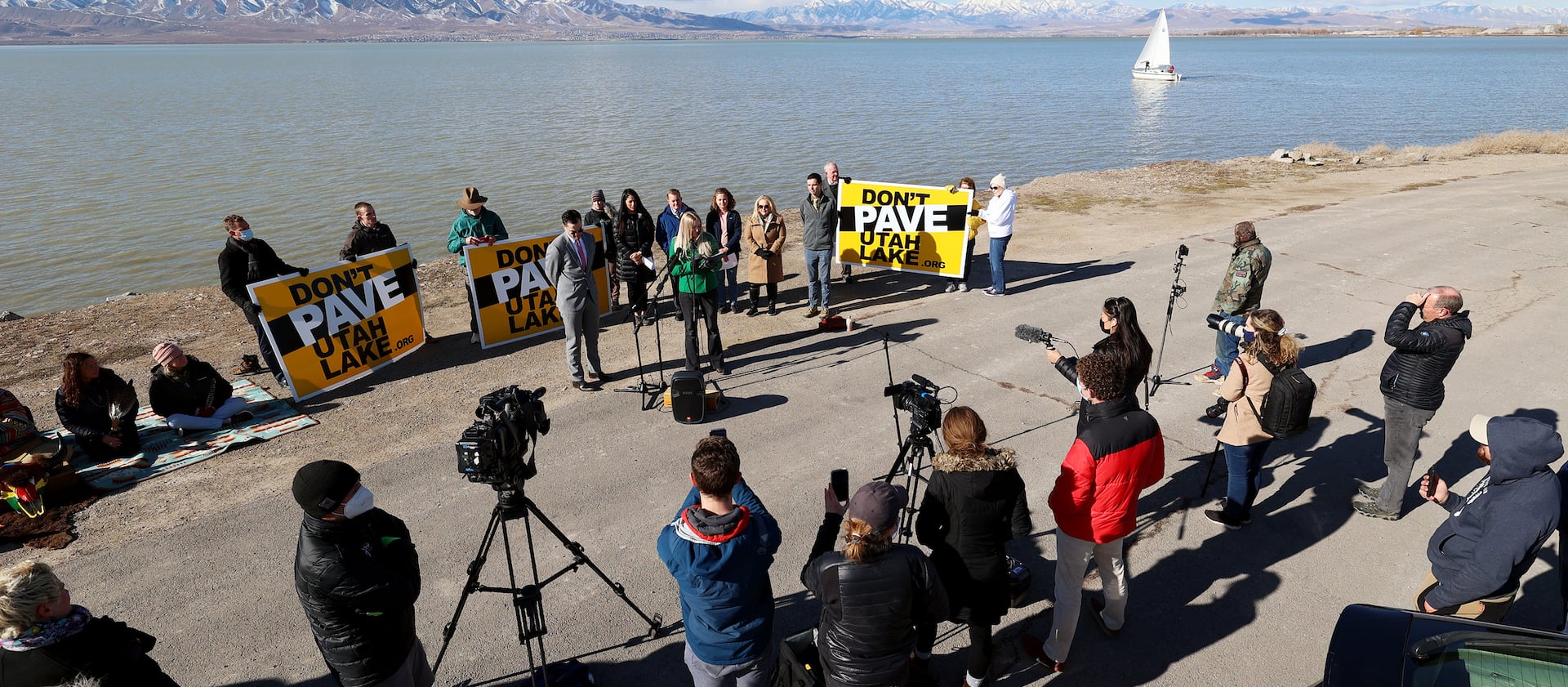 Whit Krogue, an attorney with Ray, Quinney & Nebeker, speaks at a press conference on the shores of Utah Lake in Lindon.