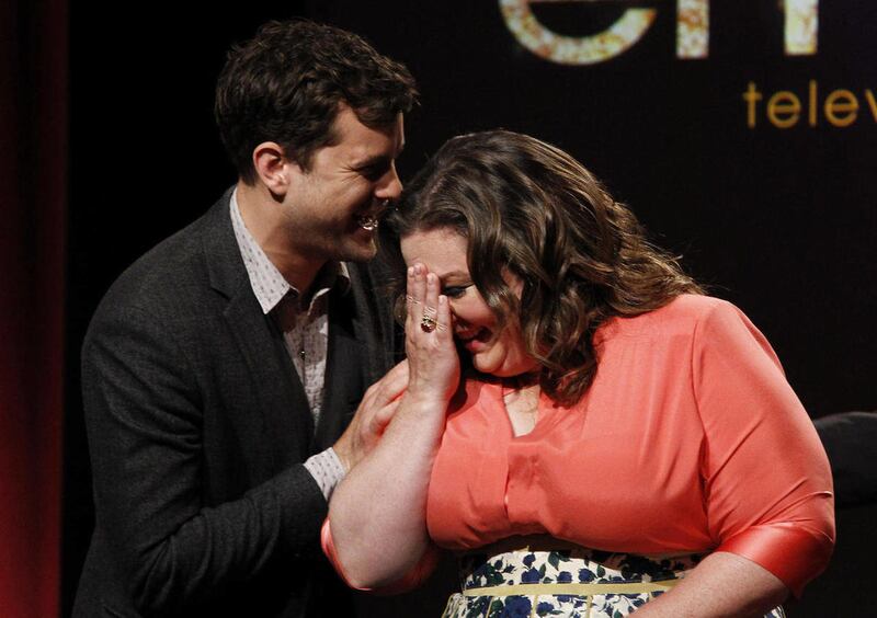 Actress Melissa McCarthy, right, is congratulated by Joshua Jackson after being nominated for Lead Actress in a Comedy Series during the nominations announcement the 63rd Primetime Emmy Awards at the Academy of Television Arts & Sciences in Los Angeles, T