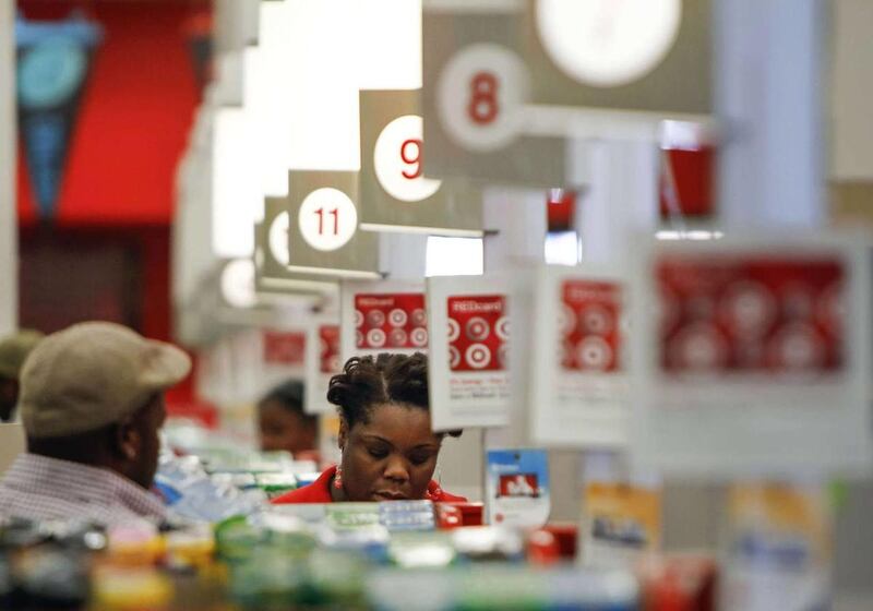 In this Wednesday, Aug. 22, 2012, photo, a cashier rings up a sale at a Target store in Chicago.