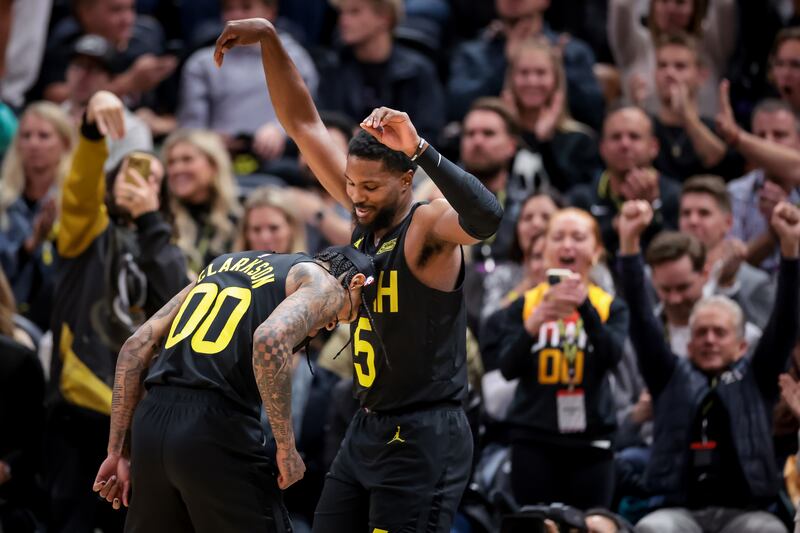 Utah Jazz guard Jordan Clarkson (00) celebrates with guard Malik Beasley after Beasley sank a three against Houston Rockets.
