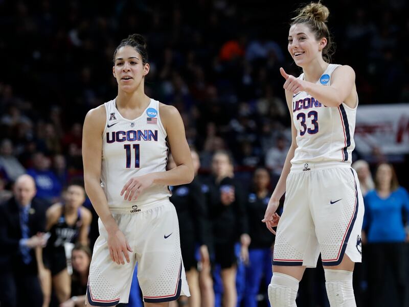 Connecticut's Kia Nurse (11) and Katie Lou Samuelson (33) gesture to teammates during the second half in a regional semifinal against Duke at the NCAA women's college basketball tournament Saturday, March 24, 2018, in Albany, N.Y. Duke won 72-59. (AP Phot