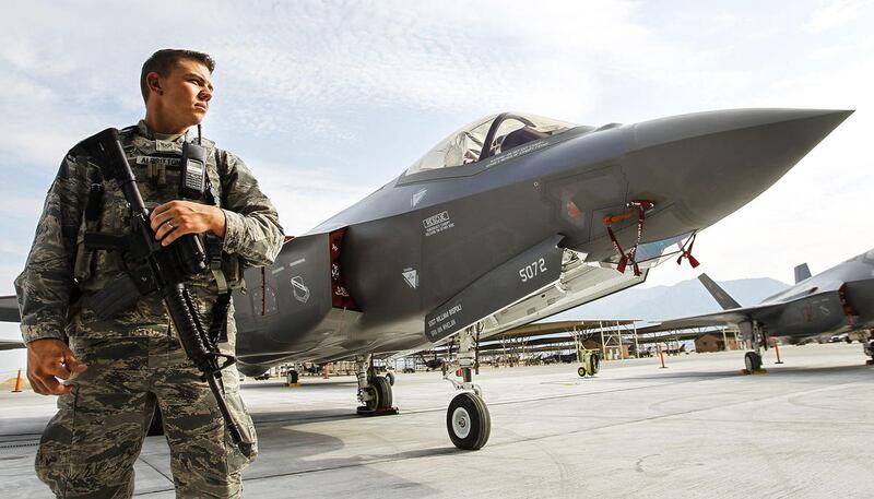 FILE &mdas; Air Force Staff Sergeant, Cody Albritton, patrols the grounds during a ceremony at Hill Air Force Base in Utah on Friday, Aug. 5, 2016.