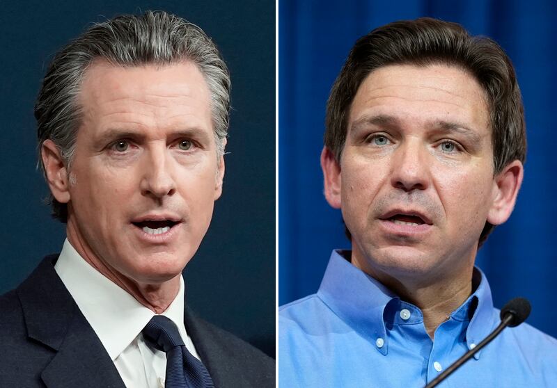 This combination of photos shows California Gov. Gavin Newsom, left, and Florida Gov. Ron DeSantis, right.