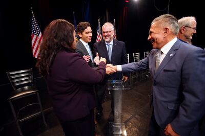 Salt Lake City mayoral candidates Luz Escamilla, David Garbett, Stan Penfold and David Ibarra shake hands following a debate in Salt Lake City on Monday, July 15, 2019. The debate was broadcast live from KSL-TV studios.