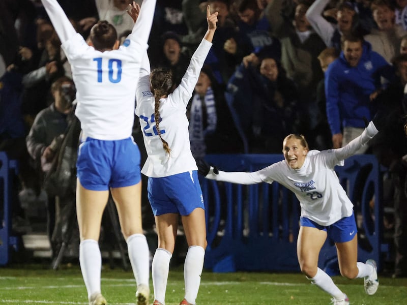 BYU midfielder Bella Folino (wearing white) celebrates her goal against USC with BYU midfielder Olivia Katoa (10) and BYU forward Allie Fryer (23)