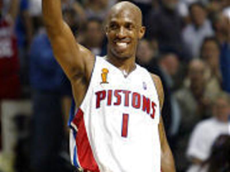 Chauncey Billups, smiling as he celebrates Pistons' victory Tuesday, was named Finals MVP. 'Yeah, baby,' he said as he hoisted the trophy.