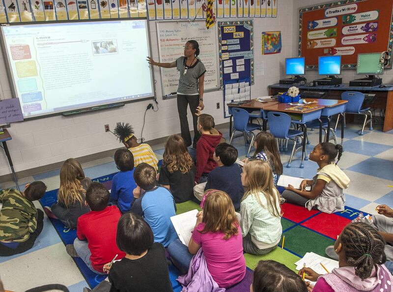 In this photo taken on Dec. 2, 2013, Latoya Alexander teaches her third graders about the nation and culture of China at Pershing Hill Elementary School in Fort Meade, Md.