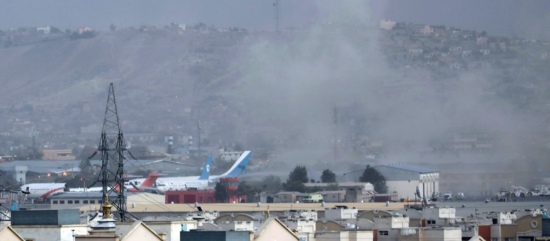 Smoke rises from a deadly explosion outside of the airport in Kabul, Afghanistan, on Thursday, Aug. 26, 2021.