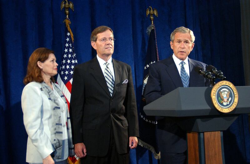 President George W. Bush introduces former Utah Governor Mike Leavitt during a press conference.