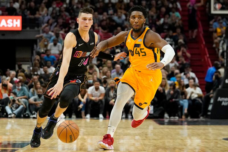 Miami Heat guard Tyler Herro (14) drives to the basket as Utah Jazz guard Donovan Mitchell (45) defends. Could the pair be swapped in a trade this offseason?