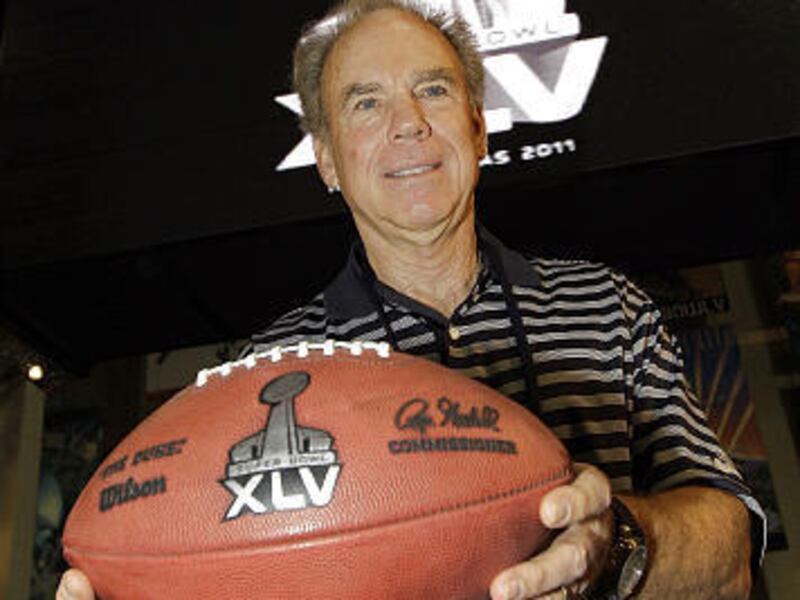 Hall of Fame quarterback Roger Staubach displays the logo for the Super Bowl XLV in Fort Lauderdale, Fla., last February.