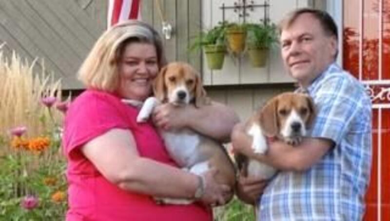 Julie Hardle, shown here with her husband, Jim, and her beagles, Cooey and Tariq, spent years suffering from mental illness but now helps others who are on their own journeys to wellness.