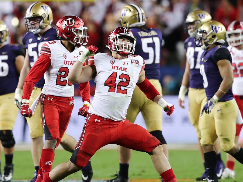 Utah Utes defensive end Mika Tafua (42) celebrates a sack as Utah and Washington play in the Pac-12 championship game.
