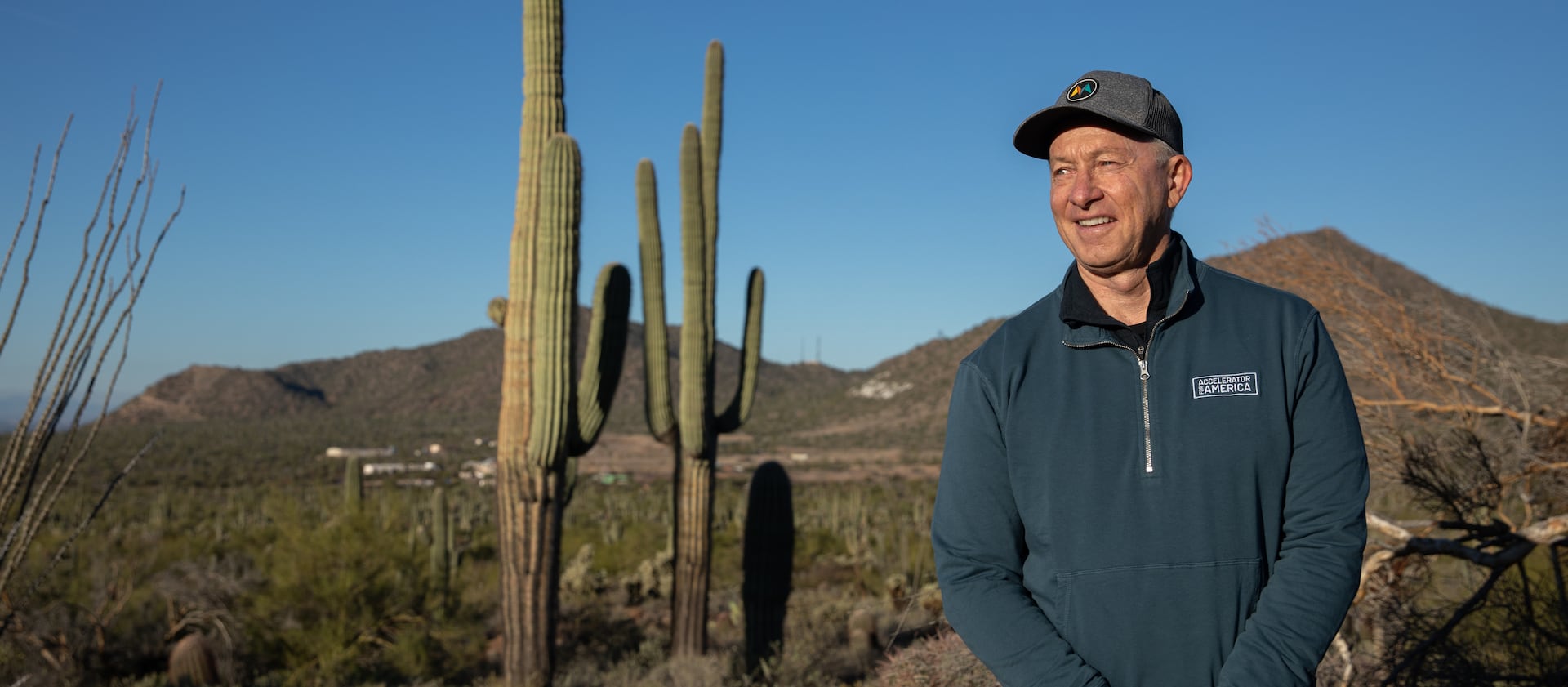 Mesa Mayor John Giles stands for a portrait among cacti while on a morning hike in Mesa, Ariz., on Dec. 8, 2022.